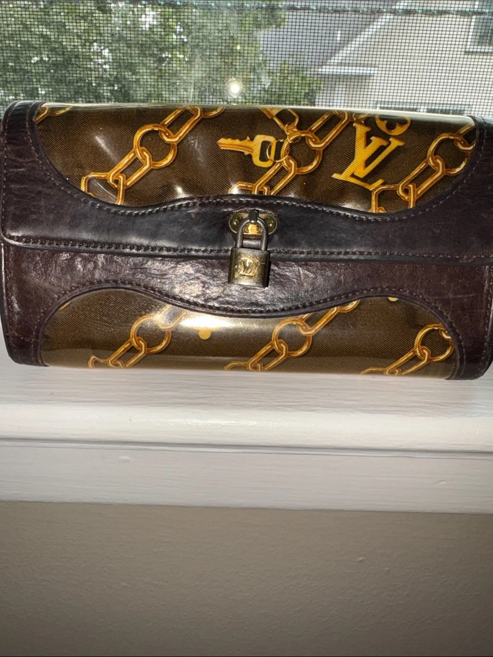 Louis Vuitton Monogram Charms Porte-Monnaie Wallet in brown (7.5 x 4in.)